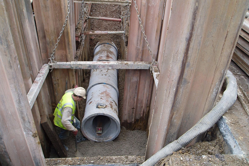 opencut-1 Image of excavated material and a new pipe being installed in the required depth